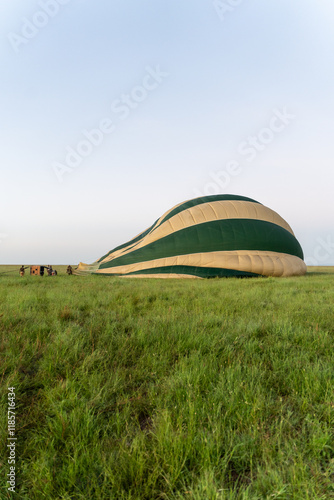Photography Hot air balloons in the Serengeti, Tanzania taking flight over the park from a f