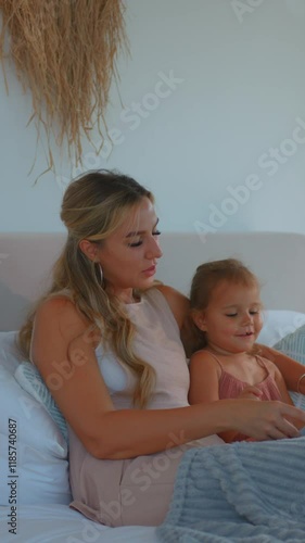 Tender Moments Enjoying the Experience of Reading Together on a Cozy and Comfortable Couch