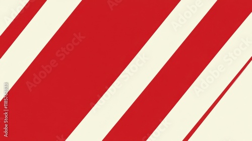 A simple candy cane with red and white stripes, placed diagonally on a white background for a festive look. photo