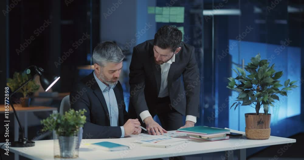 Business team of caucasian managers engaged in corporate night meeting negotiating ideas working long hours. Workaholic lifestyle. teamwork. Business team of caucasian managers engaged in corporate night meeting negotiating ideas working long hours. Workaholic lifestyle. teamwork.