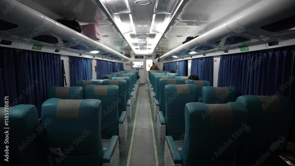 Empty seats on a passenger train in Indonesia at night. Empty seats on a passenger train in Indonesia at night.