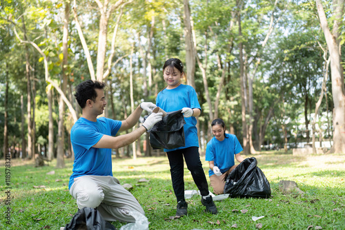 Fotografie Family enjoying a fun and rewarding garbage collection experience in a vibrant p