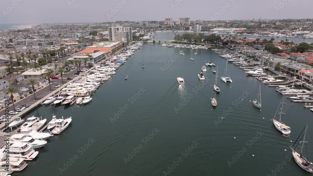 Aerial Flyover Of Luxury Boats And Yachts In Newport Bay At Newport Beach In Orange County, California. Aerial Flyover Of Luxury Boats And Yachts In Newport Bay At Newport Beach In Orange County, California.