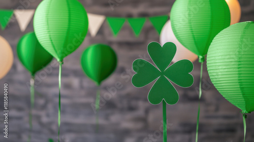 Colorful St. Patrick's Day decorations featuring green hats, a whimsical mustached face, and shamrock cutouts on a wooden background. photo