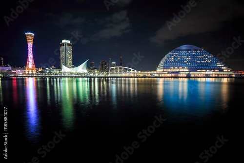 Illuminated Kobe Waterfront at Night with City Reflections