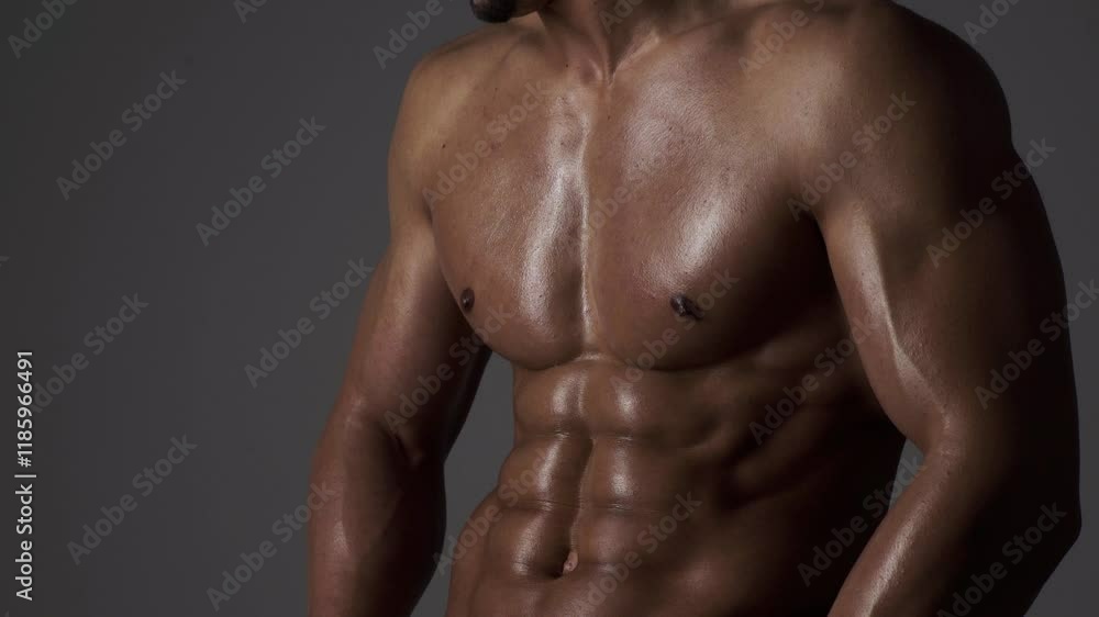 Six pack. Perfect abs, shoulders, and chest. Close up the Abs. Closeup torso. Ab. Muscular torso and ripped abs. Sexy male muscular body. Man with naked torso showing six pack abs. Six pack. Perfect abs, shoulders, and chest. Close up the Abs. Closeup torso. Ab. Muscular torso and ripped abs. Sexy male muscular body. Man with naked torso showing six pack abs.