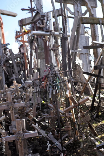 Thousands of religious symbols, crucifixes, rosaries, rosary and catholic crosses with Jesus, Hill of Crosses, Kryžių kalnas,  is a site of pilgrimage north of of Šiauliai, Lithuania