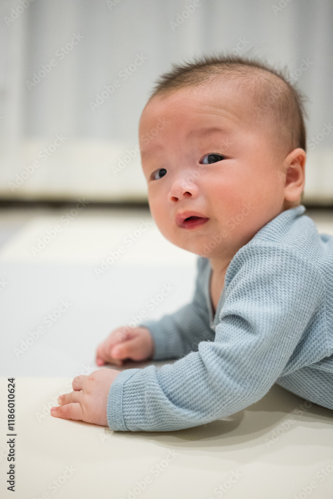 Baby crawling on mat indoors Baby crawling on mat indoors