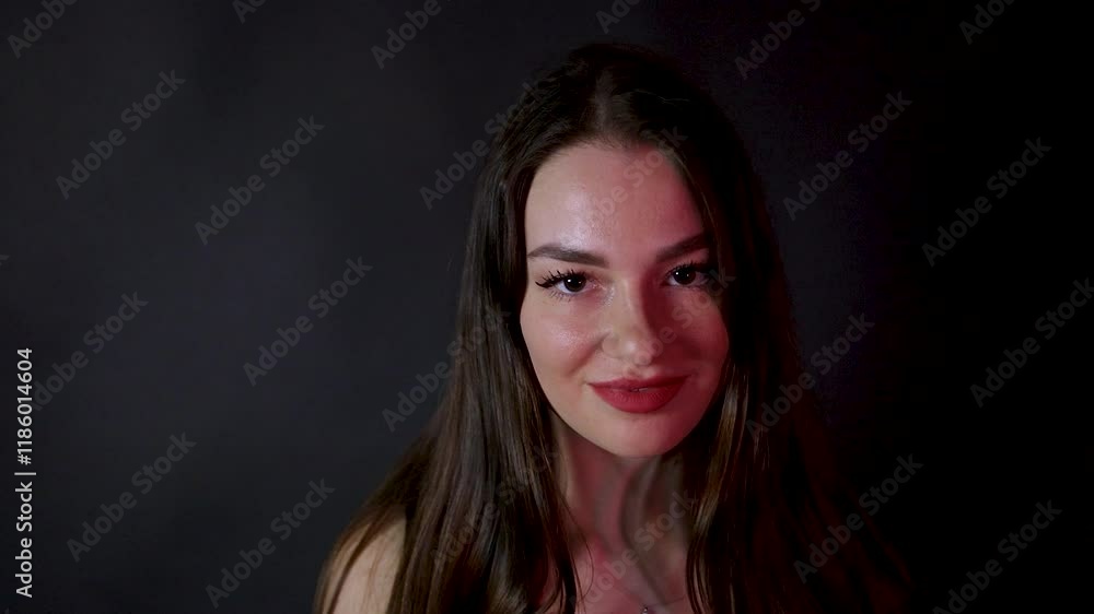 Young seductive Caucasian model posing in a dark studio Young seductive Caucasian model posing in a dark studio