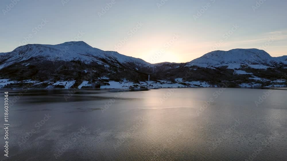 Aerial view across the Kvernes fjord to the majestic snow-covered mountains of Gjemnes municipality Aerial view across the Kvernes fjord to the majestic snow-covered mountains of Gjemnes municipality