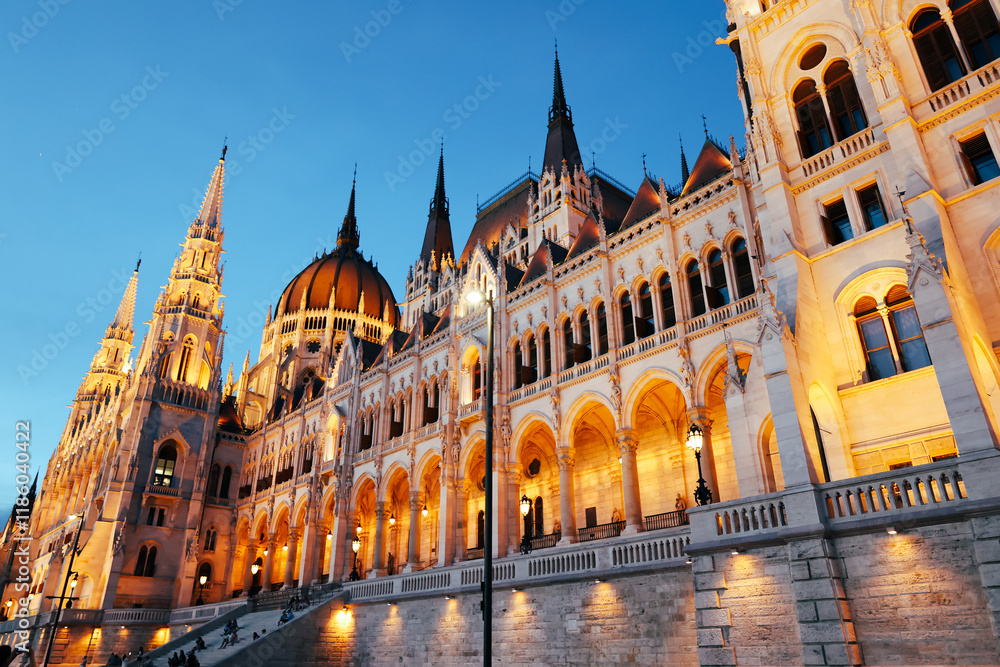 Obraz premium The Parliament building in Budapest. Tourist attraction in Europe. The picture is taken in the evening. Europe tourist travel attraction.