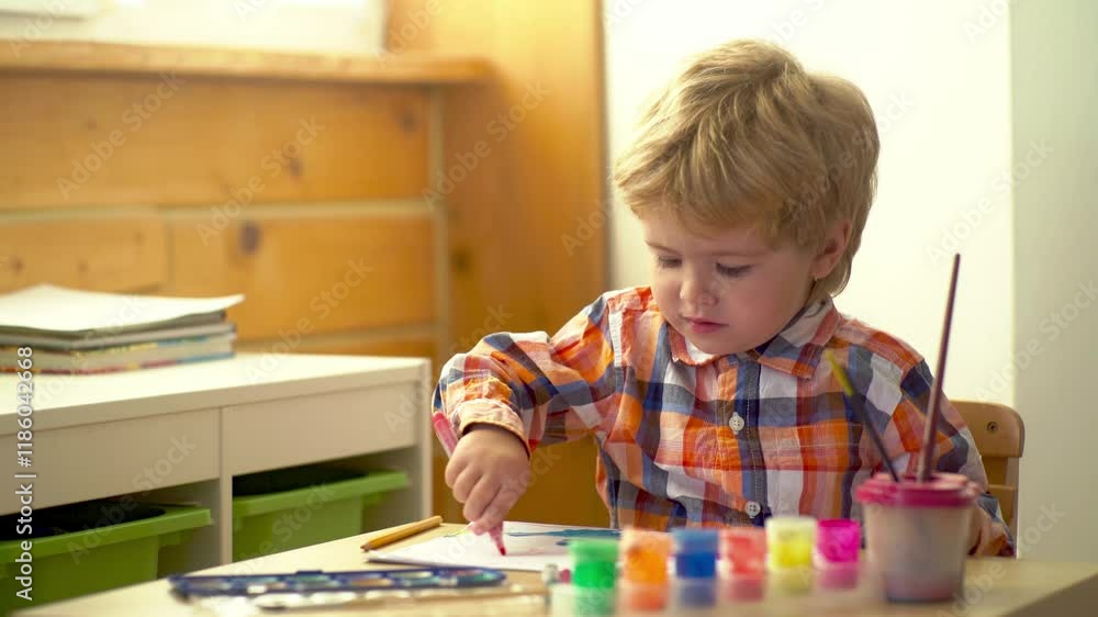 Cute little child painting and drawing. Kid with crayons and draw on paper. Creative thinking and kids artistic concepts. Child painting with paint brush and watercolors. Baby painting. Cute little child painting and drawing. Kid with crayons and draw on paper. Creative thinking and kids artistic concepts. Child painting with paint brush and watercolors. Baby painting.