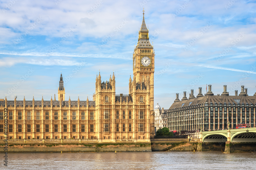 Fototapeta premium View to Palace of Westminster across river Thames, London. Copy space in sky.