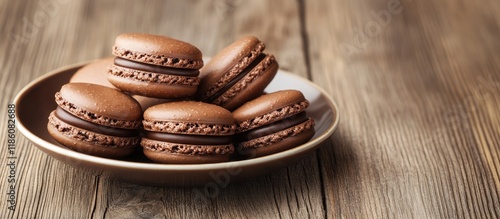 A plate of chocolate macaro...