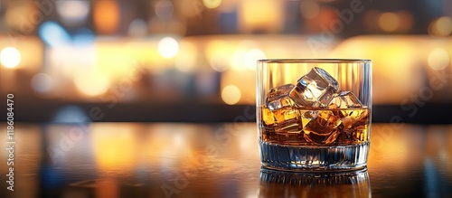 A whisky glass with ice on ...