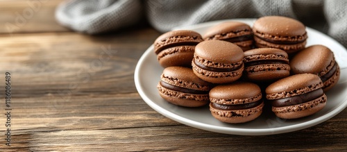 A plate of chocolate macaro...