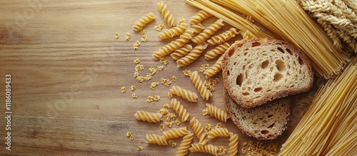 Wheat grains alongside dry pasta and a slice of bread on a wooden surface. with copy space image. Place for adding text or design photo