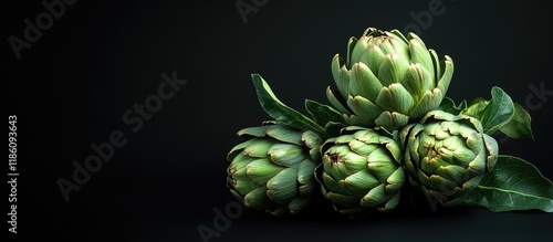Fresh raw artichokes on a b...