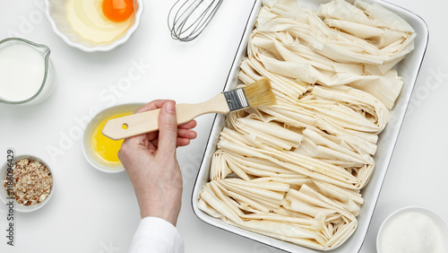 Baking dish near Crinkle Cake filo dough a butter for buttering photo