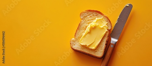 Spreading butter on toast u...