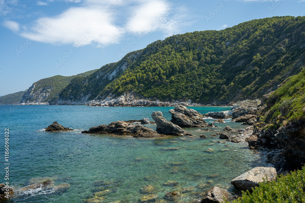View of the sea, mountains, rocks, beaches, islands and the sky from different sides of the Skopelos island Greece. View of the sea, mountains, rocks, beaches, islands and the sky from different sides of the Skopelos island Greece.