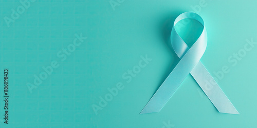 Teal ribbon awareness symbol on turquoise background, representing support photo