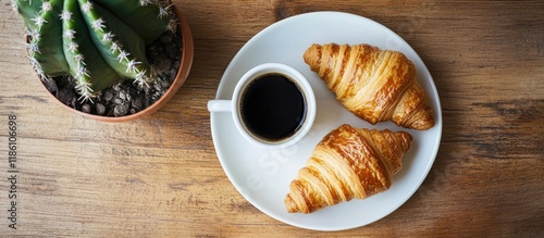Two croissants on a saucer ...