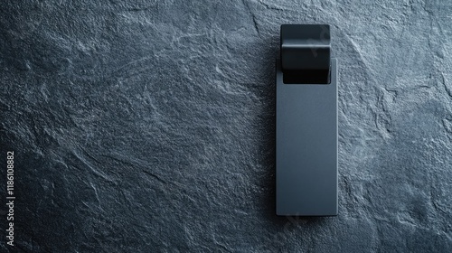 Modern black collar clip with minimalist design, isolated against a textured gray surface.