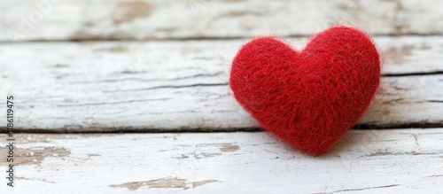 Red wool heart shape on a w...
