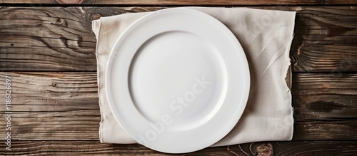 Empty white plate on a ligh...