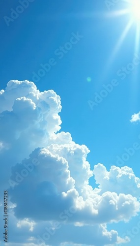 White puffy clouds in a bright blue spring sky with a few scattered sunbeams, spring, warm, light