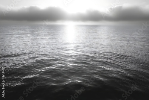 Sunlit ocean surface with low clouds.