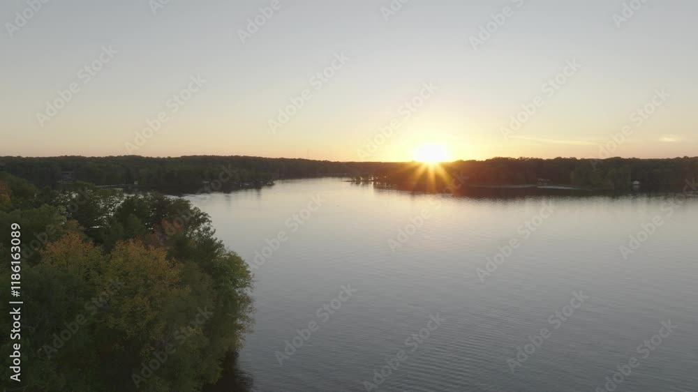 Aerial view of Balsam Lake, Wisconsin, during sunset in the late summer season. Aerial view of Balsam Lake, Wisconsin, during sunset in the late summer season.