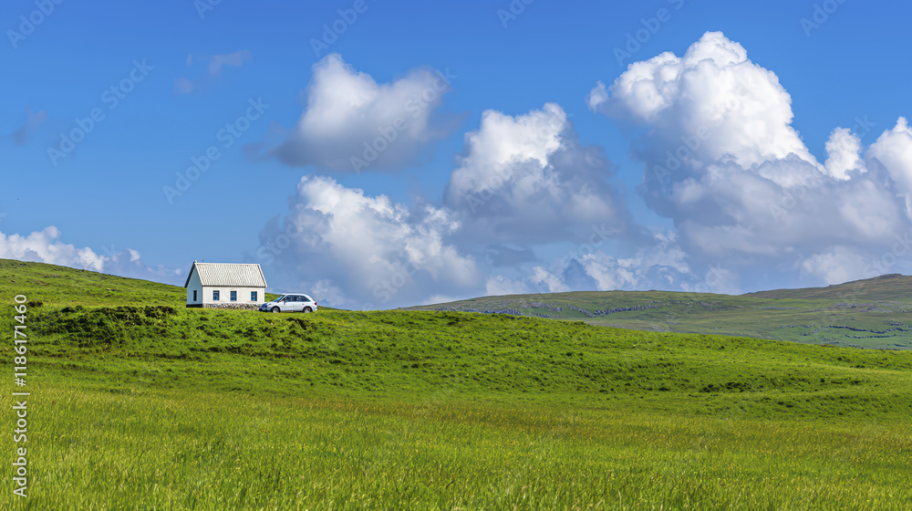 serene landscape featuring white house on green hill under blue sky with fluffy clouds serene landscape featuring white house on green hill under blue sky with fluffy clouds
