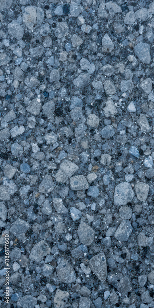 Close-up view of a textured surface made of small stones and gravel. Close-up view of a textured surface made of small stones and gravel.