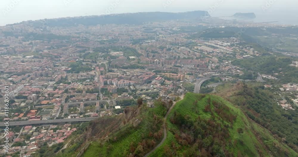 Aerial view of the outskirts of Naples, Italy. In the background the Mediterranean Sea. Aerial view of the outskirts of Naples, Italy. In the background the Mediterranean Sea.