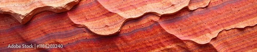 Warm crimson quartzitic sandstone with striations, red sandstone, sedimentary rock photo