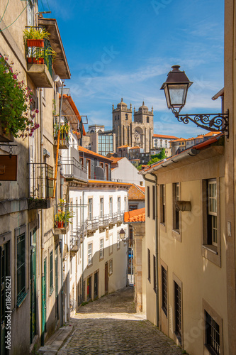 Generated imageRoman Catholic church Sé do Porto or The Porto Cathedral in Porto (Oporto), Portugal. View from narrow street. Blue sky. Religion. Travel photography.