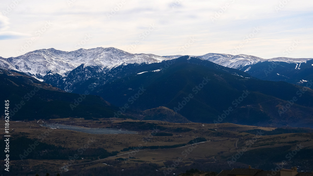 Snow-capped mountains in haze, view from the village of Font-Romeu, France, tourism, vacation Snow-capped mountains in haze, view from the village of Font-Romeu, France, tourism, vacation