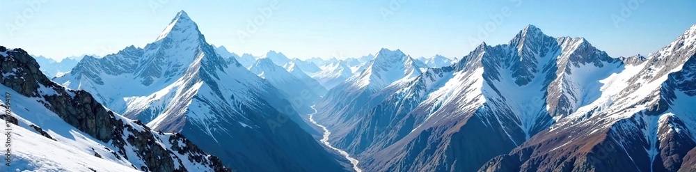 Obraz premium Mountain range with snow-capped peaks and valleys below, rugged, rocky, ice