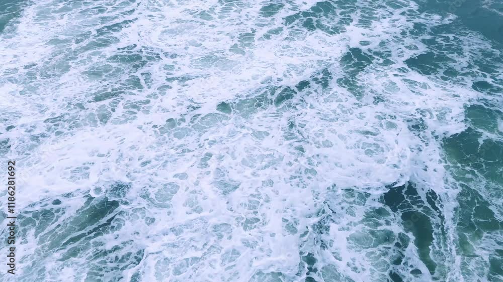 Ocean Waves Crashing in Foamy Patterns at Sunset