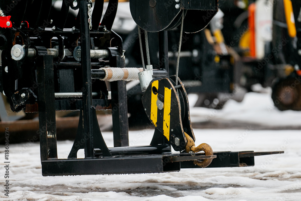 Industrial construction lifting winch electric hoist system in construction yard on high heavy duty machinery Industrial construction lifting winch electric hoist system in construction yard on high heavy duty machinery