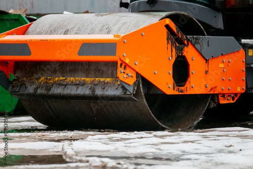 Vibratory road roller win cold winter standing in idle in construction off season not working while industry is not moving photo