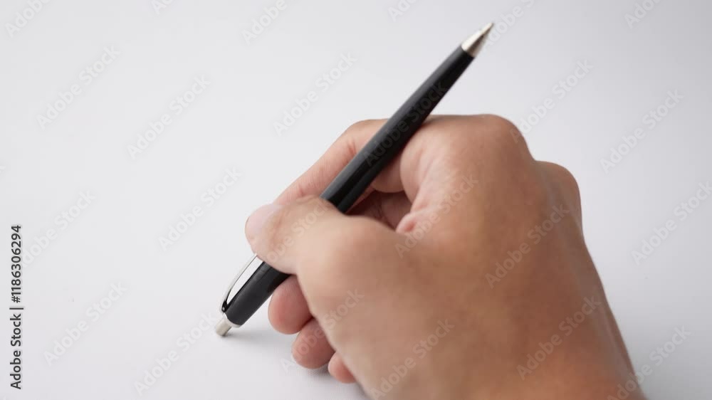 Someone is tapping the tip of their pen against the table, a psichological gesture that indicates anxiety, impatience, or boredom. Isolated on white background Someone is tapping the tip of their pen against the table, a psichological gesture that indicates anxiety, impatience, or boredom. Isolated on white background