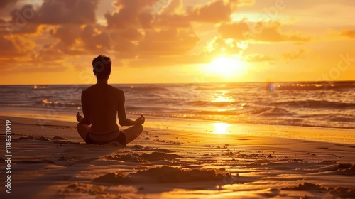 Wallpaper Mural A person meditating on the beach at sunset, promoting relaxation and mindfulness. Torontodigital.ca