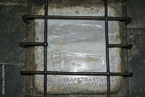 A copy of the marble stone with footprints of Jesus Christ in Church of St Mary in Palmis (Church of Domine Quo Vadis), Rome, Italy photo