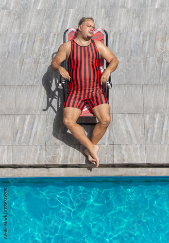 Wallpaper Mural A fat man in a striped swimsuit relaxes by the pool Torontodigital.ca