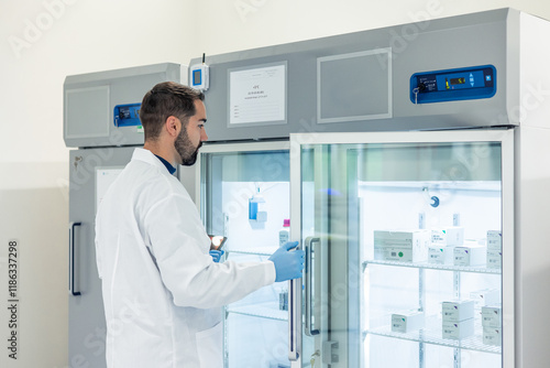 Scientist opening laboratory refrigerator containing medicines