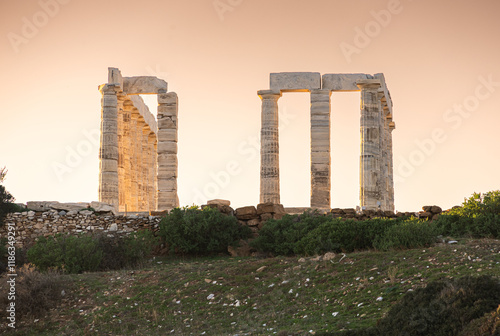 Obraz na płótnie Temple of Poseidon. Beautiful landscape with warm light sky before sunset over Poseidon Temple at Sounion Cape from Greece. Visit and travel to Greece. w salonie
