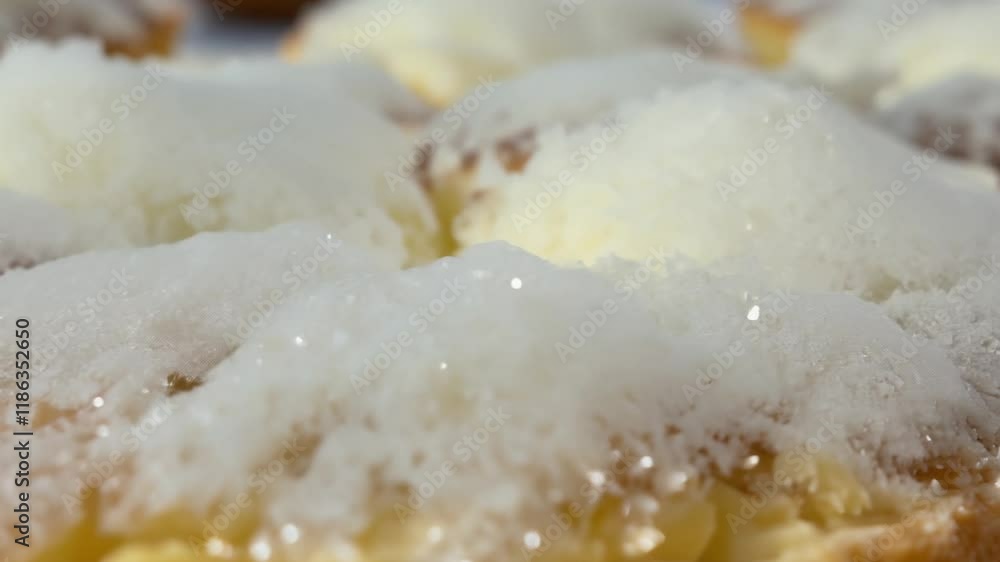 Luxurious powdered sugar sprinkled on a pastry with a natural light backdrop, fine texture, white color, delicate macro video Luxurious powdered sugar sprinkled on a pastry with a natural light backdrop, fine texture, white color, delicate macro video